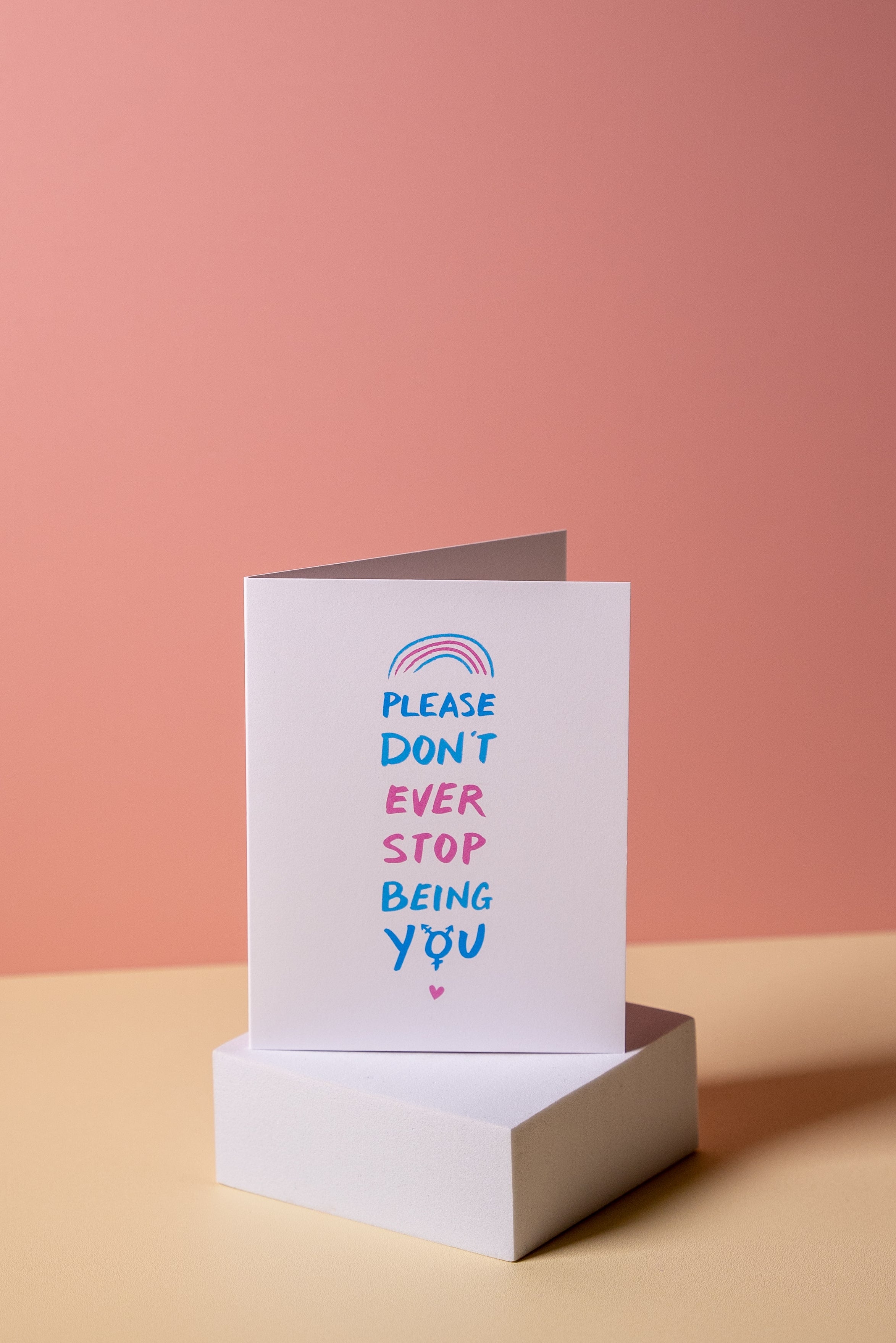 Greeting card with "Please dont ever stop being you" message on a pink background